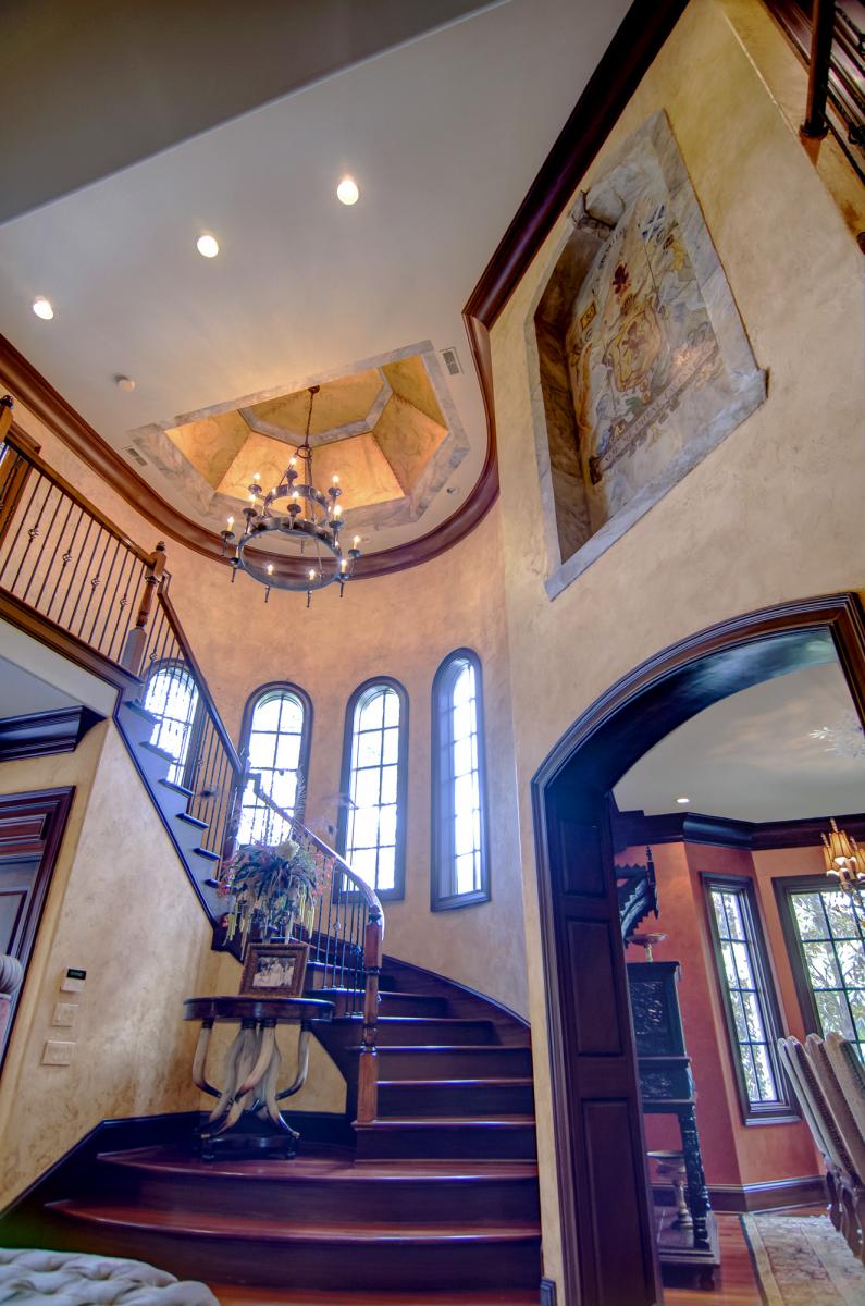 Custom ceiling design of faux gold sheeting and hand painted flourishes.