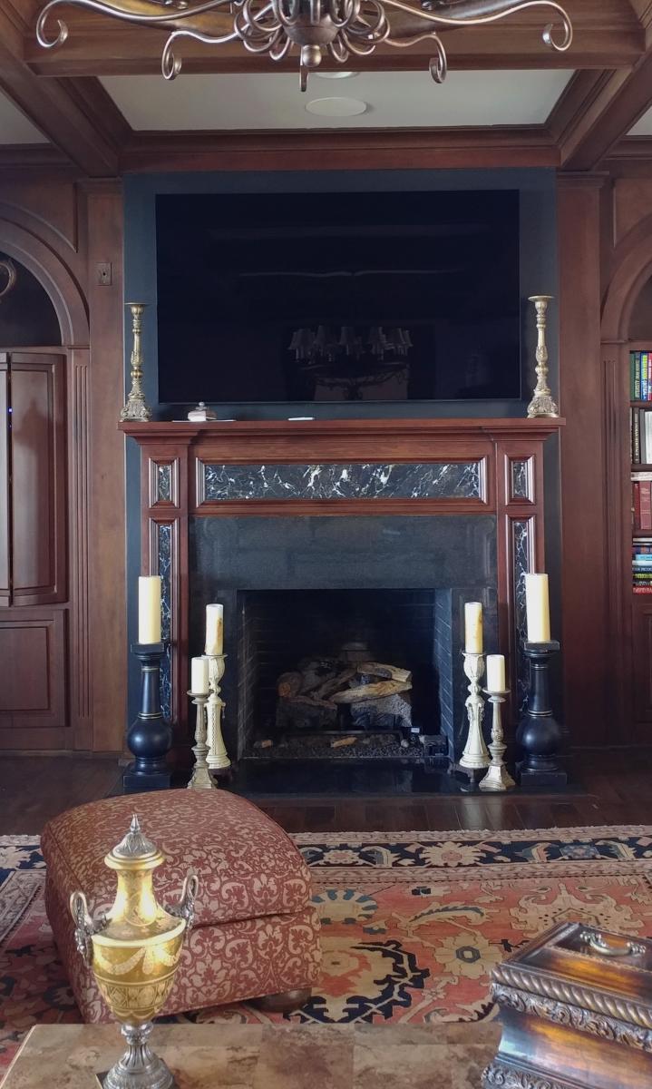 wood-grain mantel and faux marble insert.