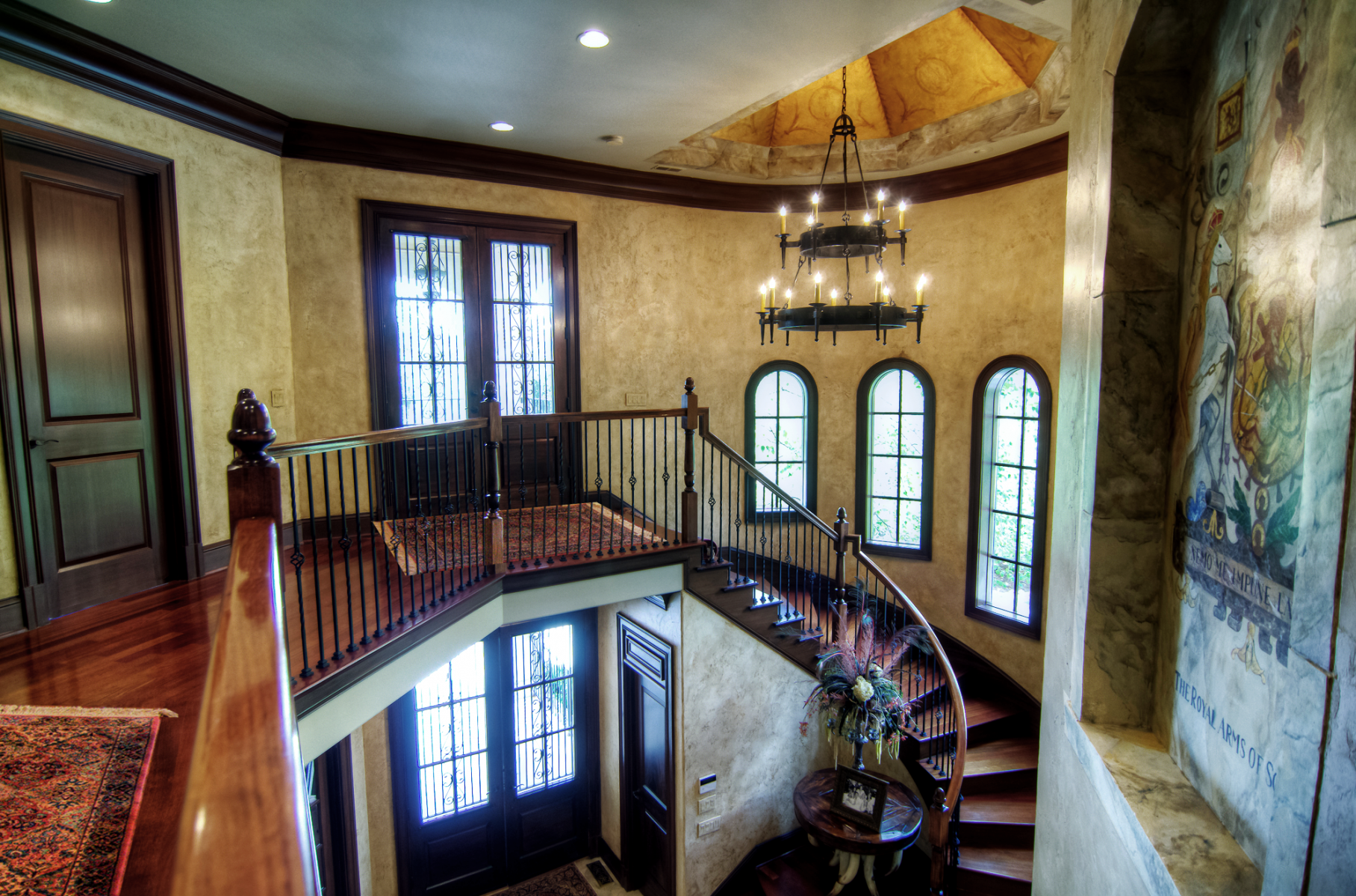 European plaster walls with wood glazed trim custom ceiling mural and marble crest.