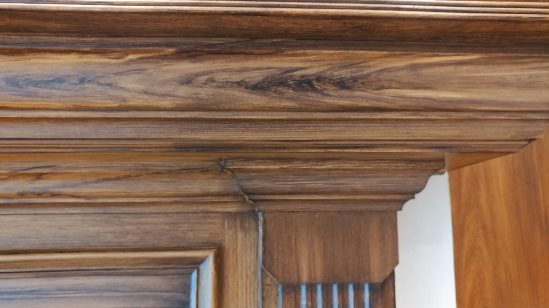 faux walnut wood grain on fireplace mantel