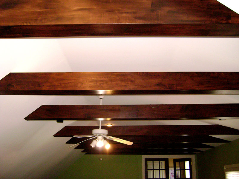 Rustic faux wood grain on false beams back