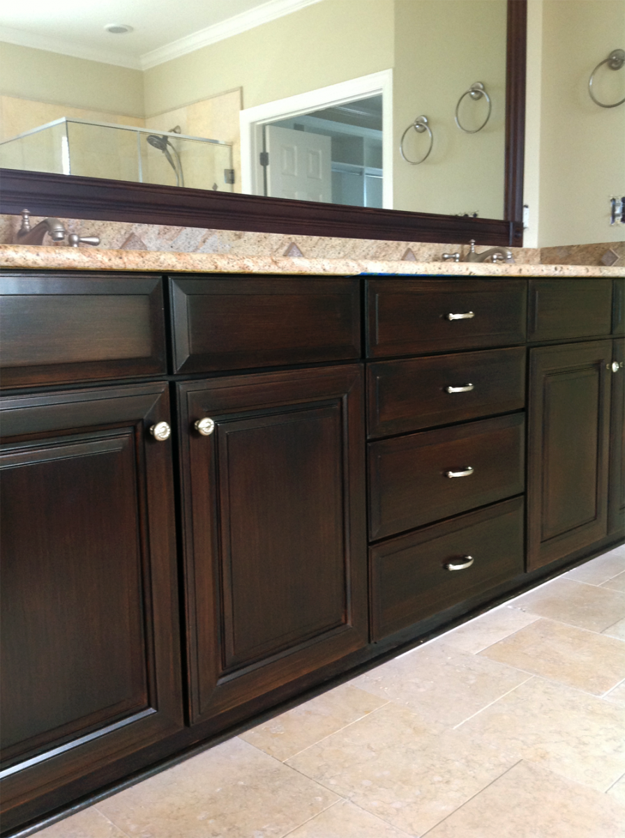 Enjoy this Brentwood, TN client's master bathroom cabinet makeover in faux wood Mahogany glaze finish. Beautiful!