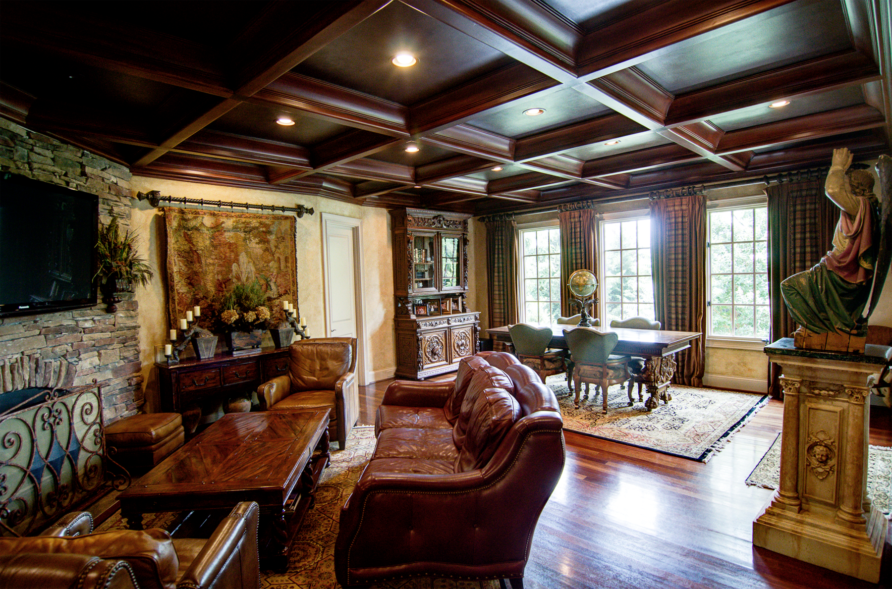 Wood grained coffer ceiling with faux metal inserts and Tuscan colored plaster walls.