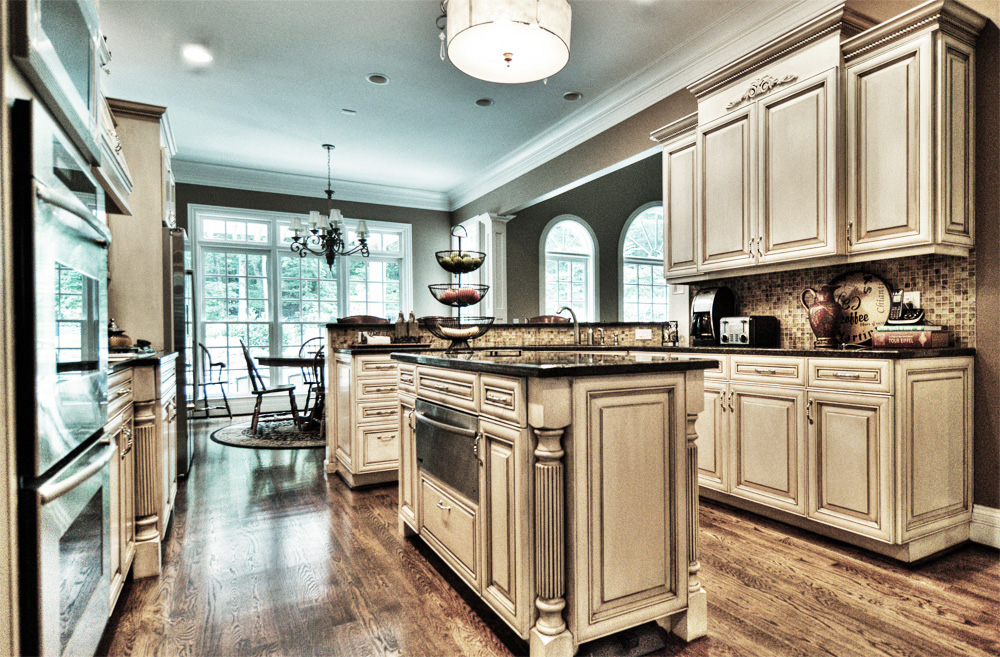 With a modern color mixture and furniture glazing technique this Franklin, TN customer's kitchen cabinets and breakfast bar were given a new life.