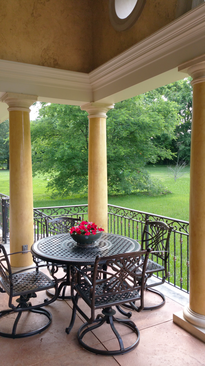 Custom designed loggia:  Venetian plaster columns with faux stone capitals and base and upper wall O’villa plaster finish.