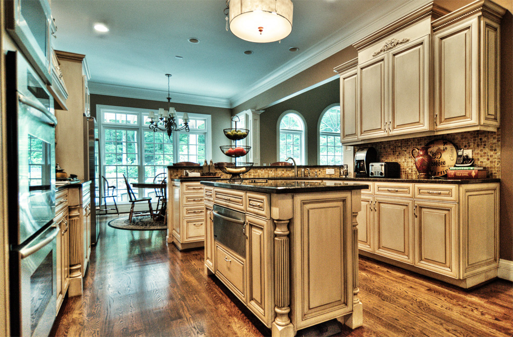 Before and After – These kitchen cabinets and breakfast bar were given a new life with modern color mixture and furniture glazing technique in Franklin, TN.