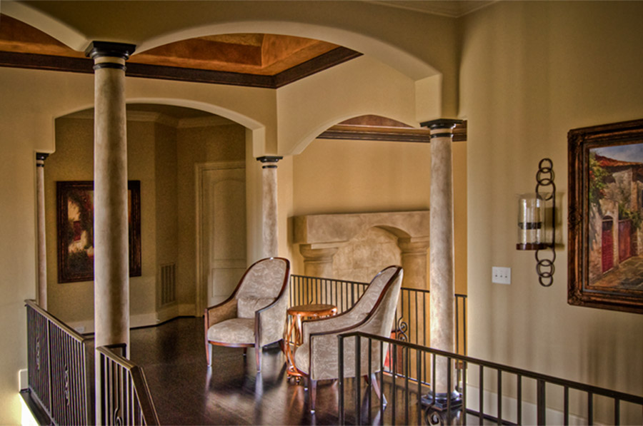 Faux stone columns and ceiling mural.