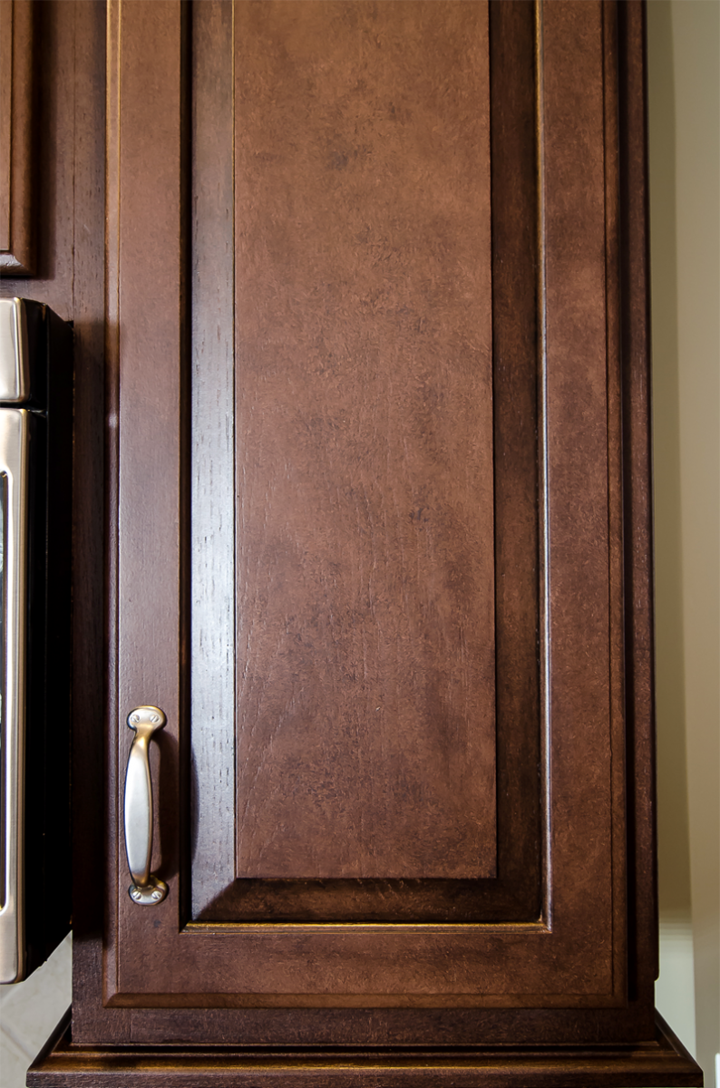 Kitchen cabinet refinishing close-up - in a rich furniture finish