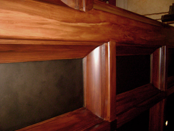 Faux wood grained coffer ceiling close-up.