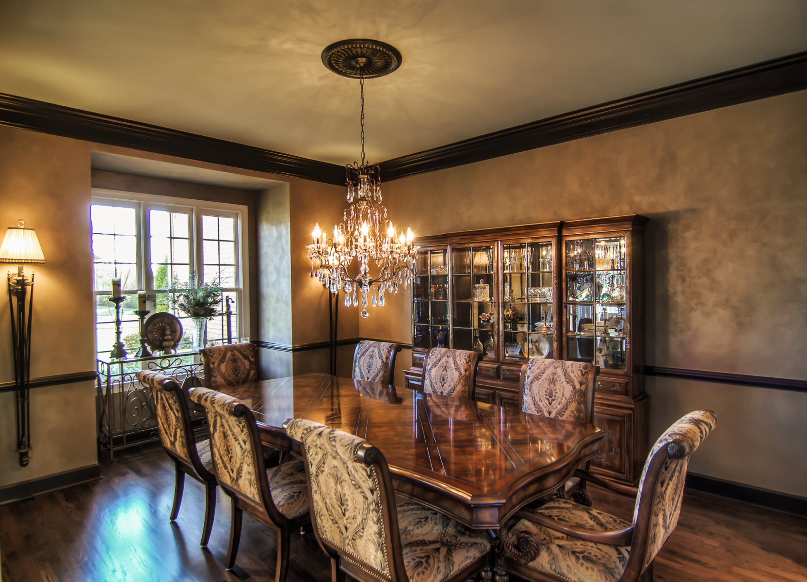 Custom blended Lusterstone for the wall finish and metallic bronze wood trim was used to achieve this elegant Franklin, TN customer’s dining room makeover.