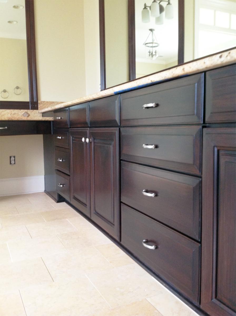 Faux mahogany wood glaze cabinet makeover for this Brentwood, TN client’s Master bathroom. Beautiful!