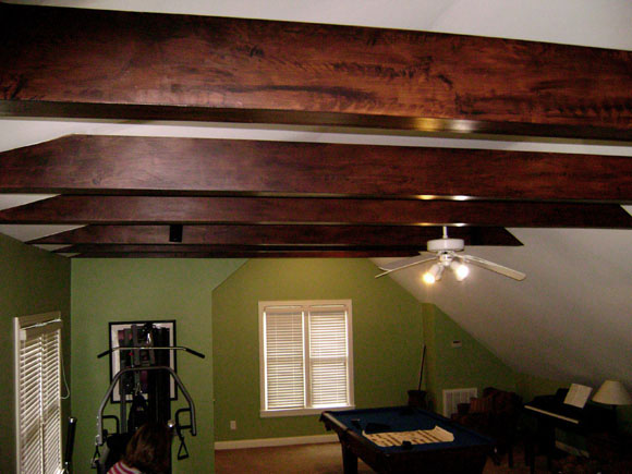 Rustic faux wood grain on false beams front