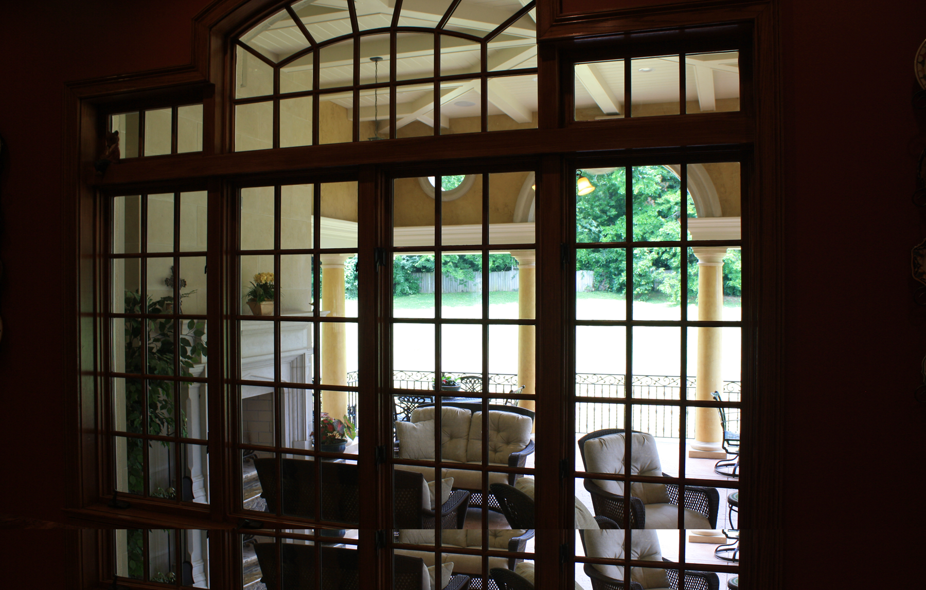 Custom designed loggia:  Venetian plaster columns with faux stone capitals and base and upper wall O’villa plaster finish.