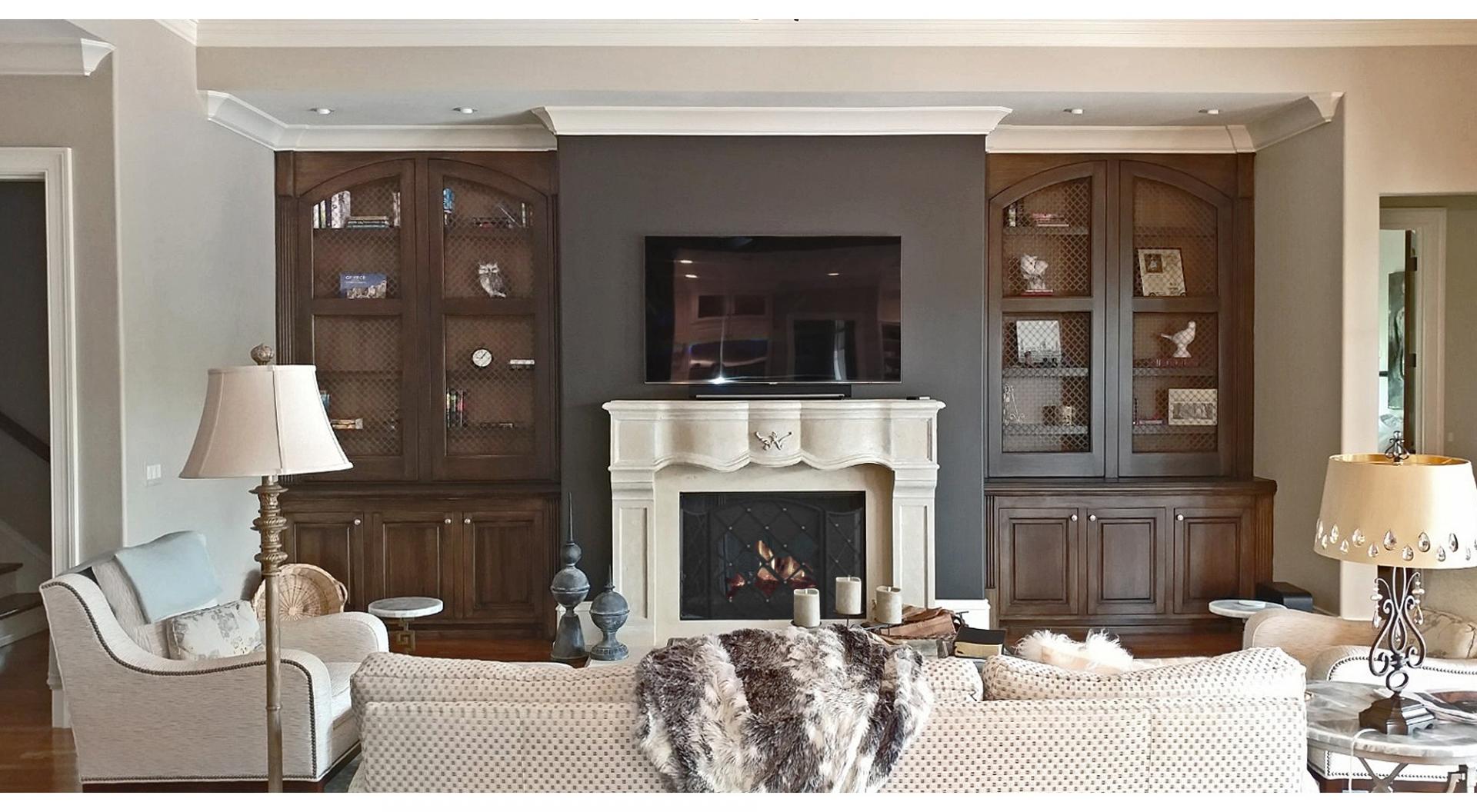 Wood grained built-in cabinets and painted feature wall and glazed hearth.