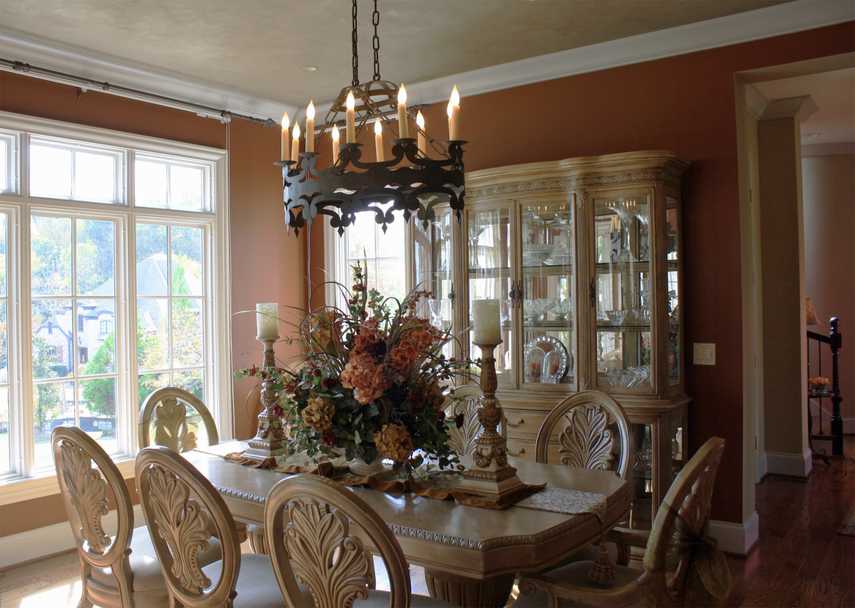 Beautiful wall color and shimmering accented ceiling complete this dining rooms design.