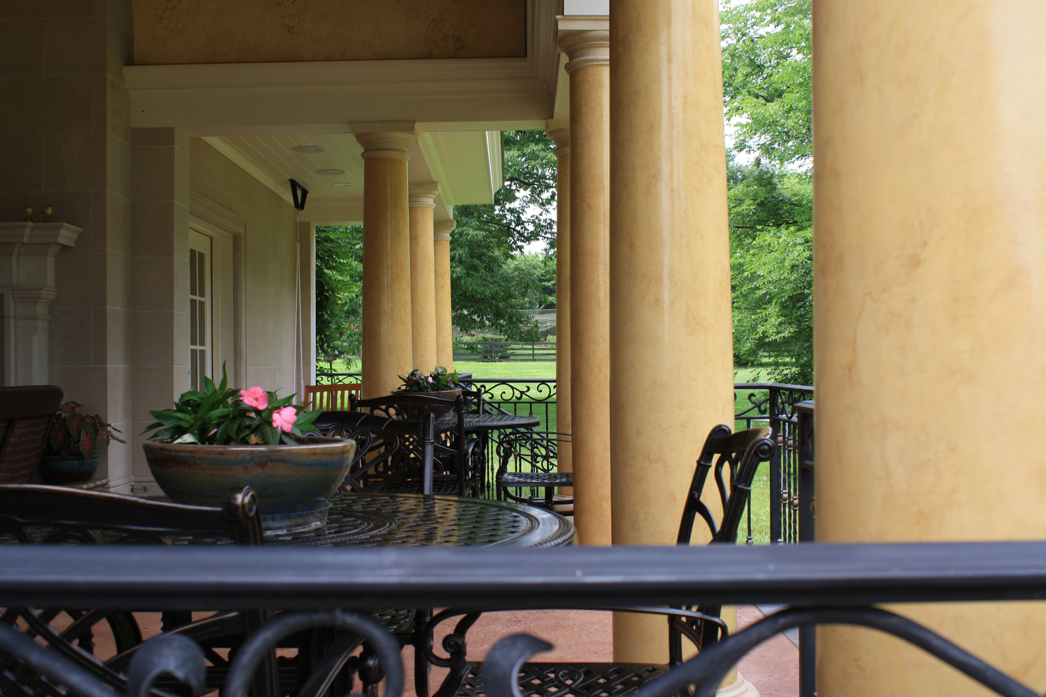 Custom designed loggia:  Venetian plaster columns with faux stone capitals and base and upper wall O’villa plaster finish.