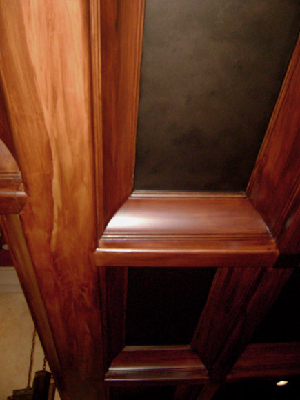 Faux wood grained coffer ceiling close-up.