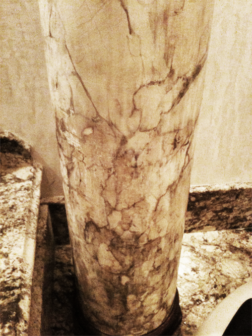 Faux marble column with bronze capital and base – designed and finished to match this customer’s existing real marble surfaces.