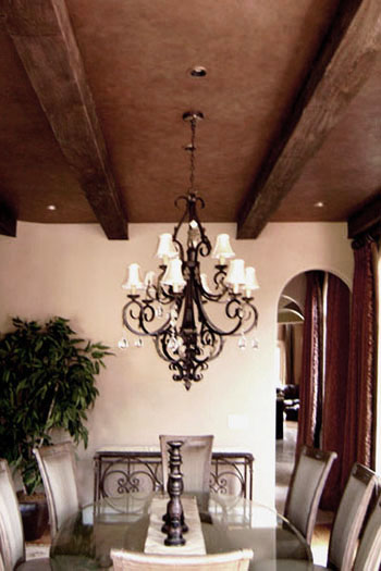 Clay colored plaster and wood grained beams.