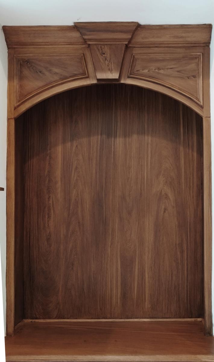 faux walnut wood grain on fireplace mantel