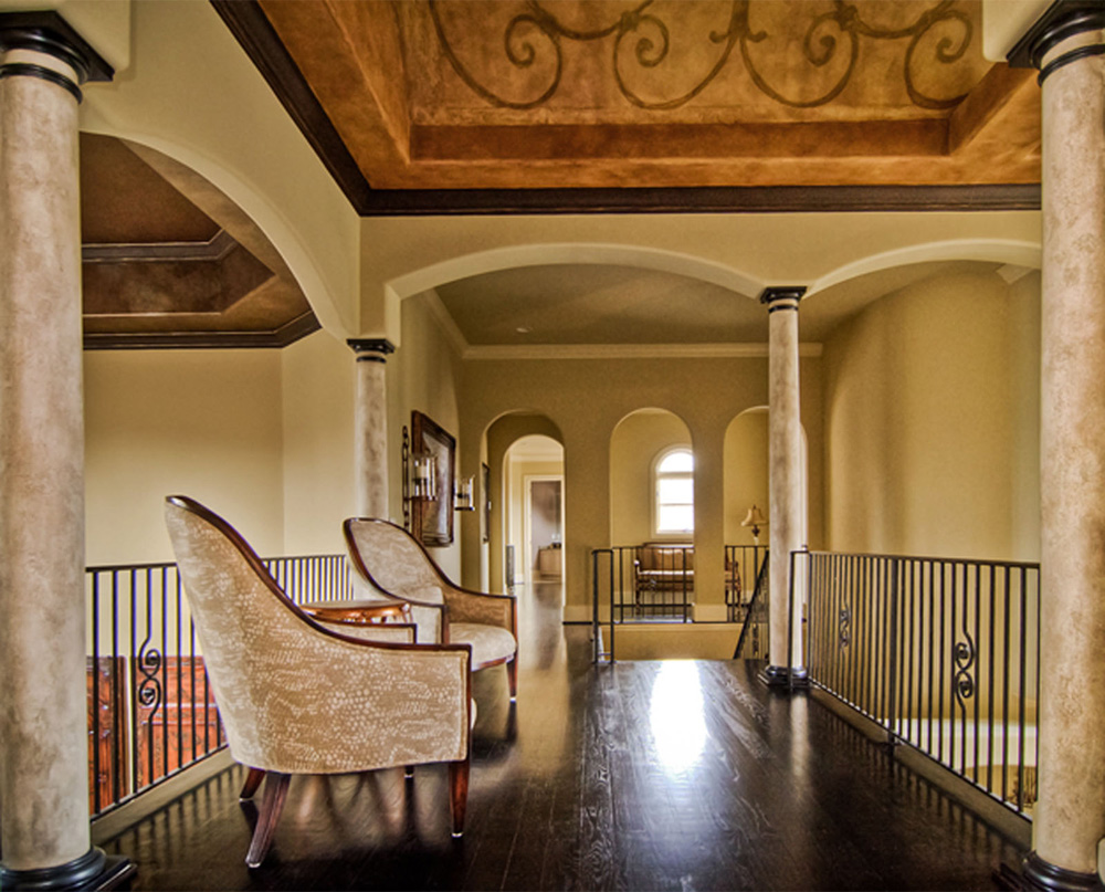 Faux stone columns and ceiling mural.